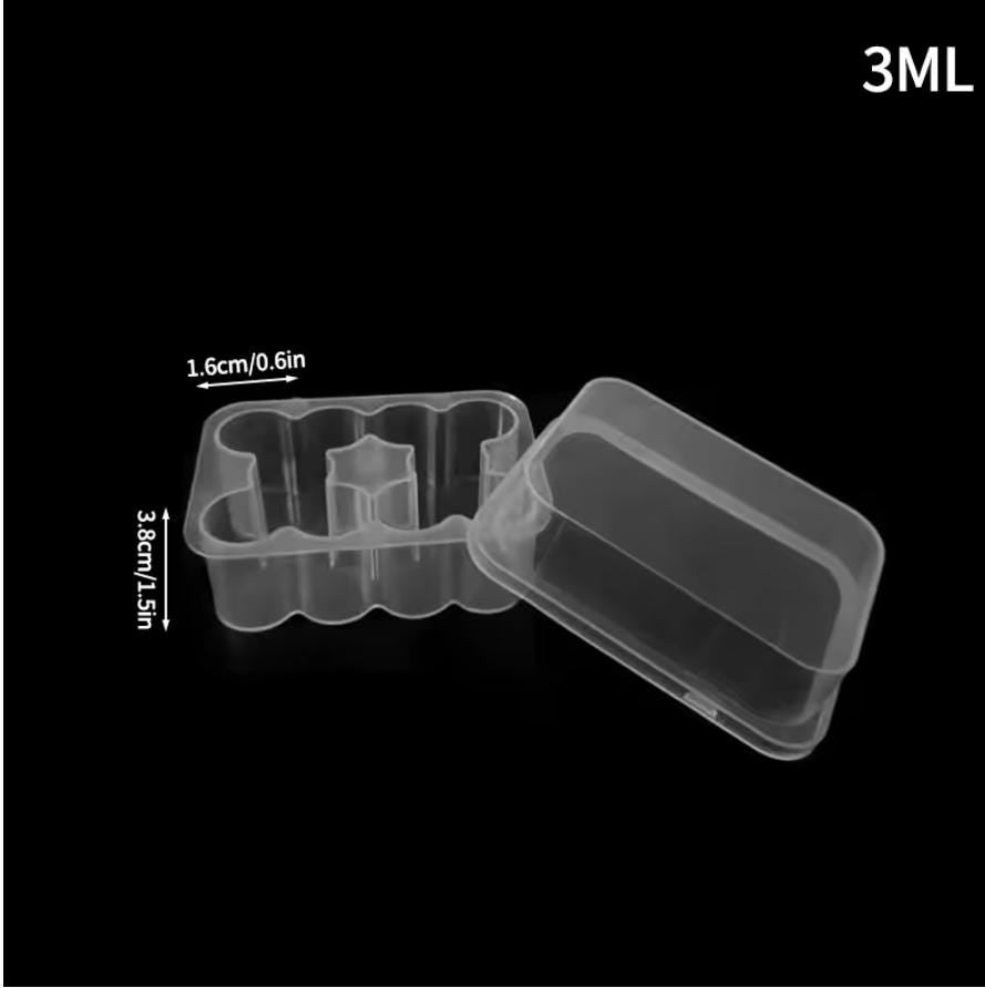 A clear plastic container with a 3ML capacity, featuring a rectangular base with internal dividers and a separate lid. The base measures 0.6 inches in width and 1.5 inches in height as indicated by the visible measurement labels.