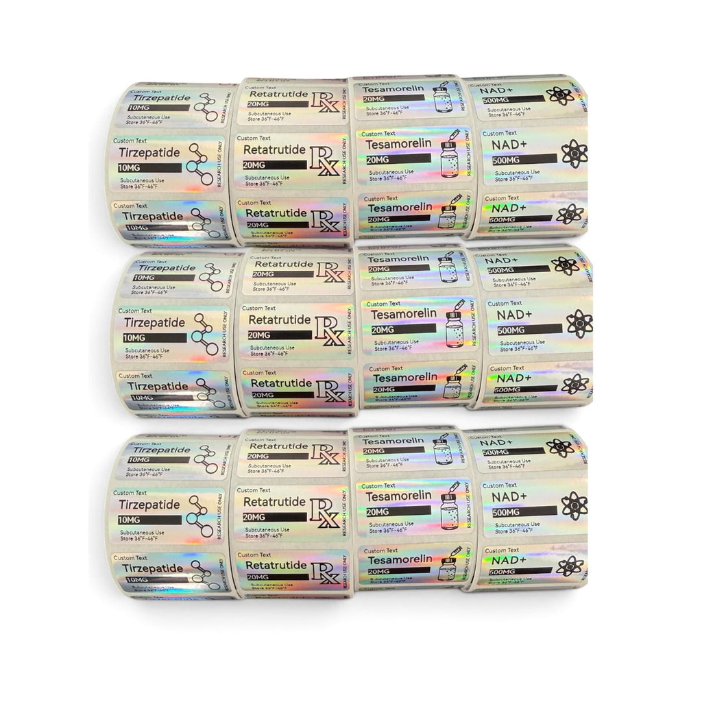 A roll of rectangular adhesive labels with a holographic finish. The labels feature black text and icons for Tirzepatide 10MG, Retatrutide 20MG, Tesamorelin 20MG, and NAD+ 500MG, including RX symbols, molecule icons, and vial illustrations.